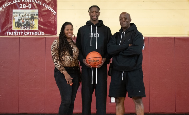 AJ Dybantsa (Brockton, Mass.) with his mother, Chelsea, and father, Ace. (Ethan Fuller/ NE Basketball Journal)